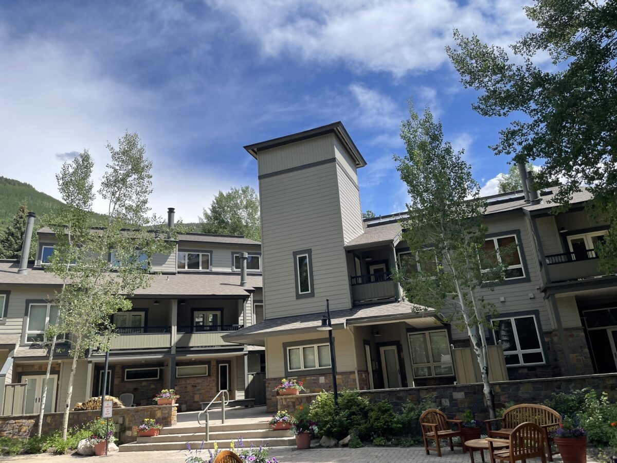 Mountain condominium buildings in Colorado with a stone-walled courtyard